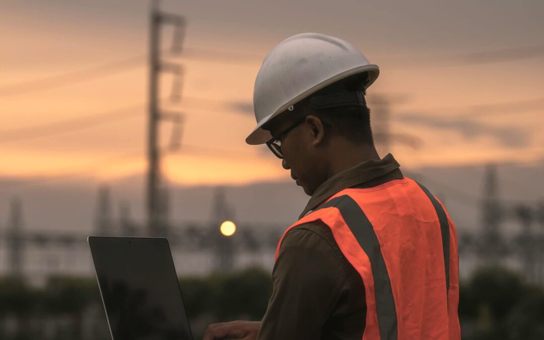 engineer holding his laptop